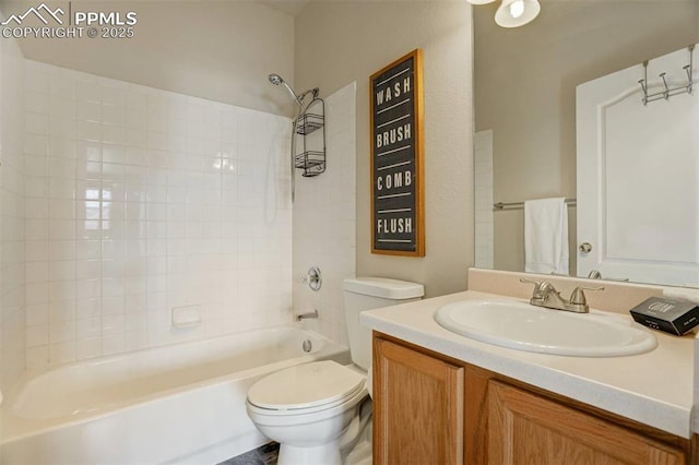 full bathroom featuring toilet, vanity, and tub / shower combination