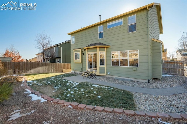 rear view of house with a patio