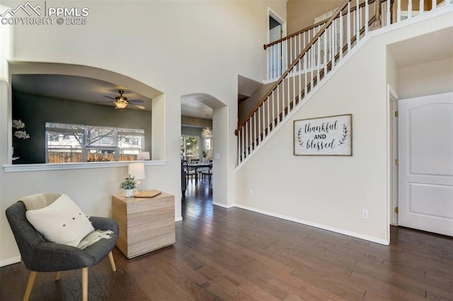 foyer entrance featuring ceiling fan and dark hardwood / wood-style flooring