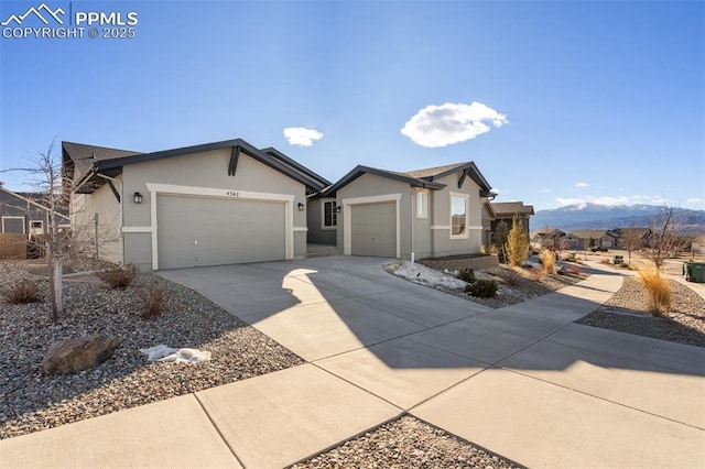 ranch-style house featuring a mountain view and a garage