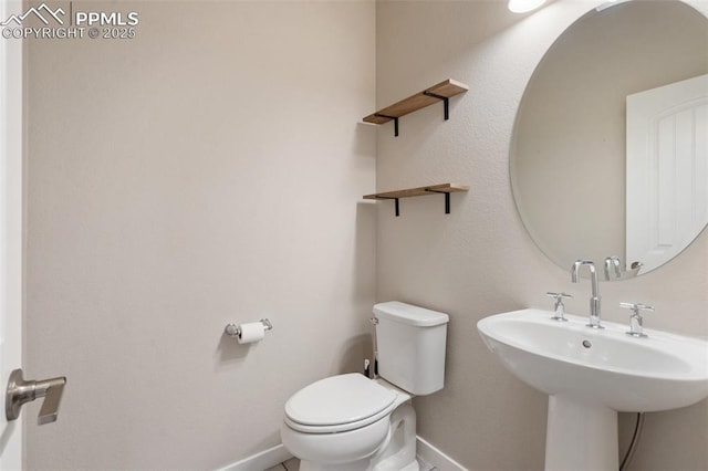 bathroom with toilet and sink