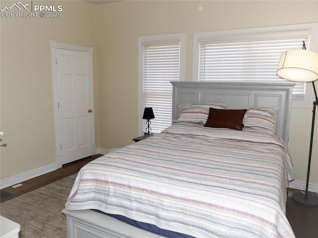 bedroom featuring dark wood-type flooring