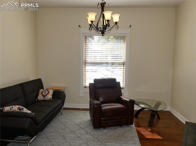 living room featuring light hardwood / wood-style flooring and a notable chandelier