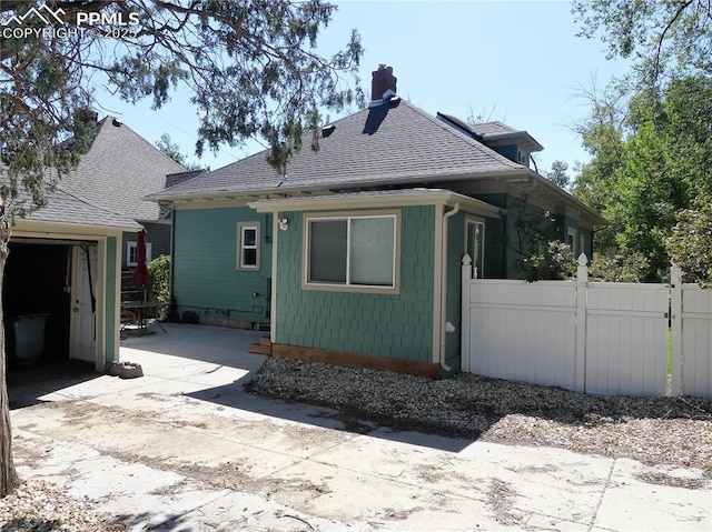 rear view of property featuring a patio