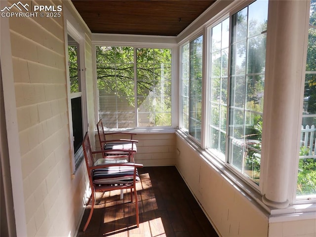 sunroom featuring wood ceiling