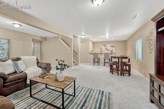 living room featuring light colored carpet