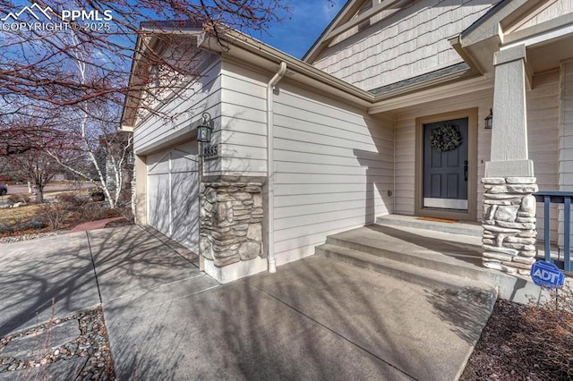 entrance to property featuring a garage