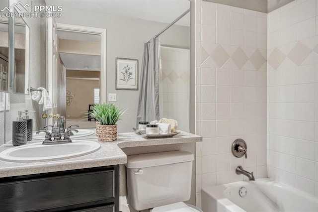 full bathroom with vanity, shower / tub combo, and toilet