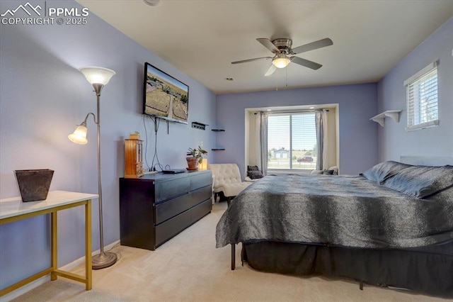 bedroom featuring ceiling fan, multiple windows, carpet flooring, and baseboards