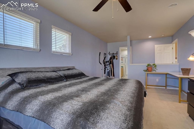 bedroom with a ceiling fan and carpet