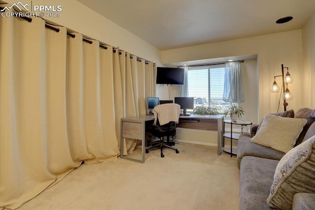 carpeted home office featuring baseboards