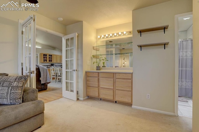 interior space with light carpet and french doors