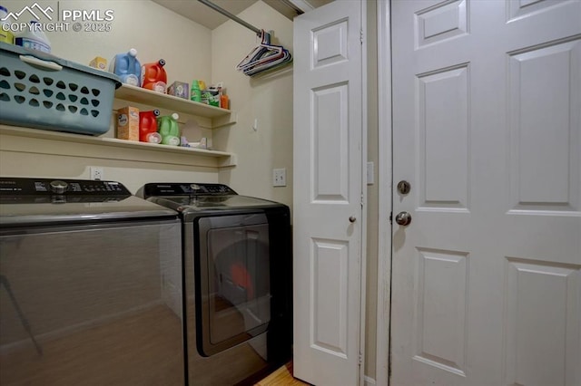 clothes washing area featuring laundry area and washing machine and dryer