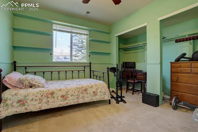 bedroom with carpet floors, visible vents, and a ceiling fan