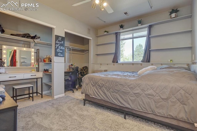 bedroom with ceiling fan, light colored carpet, and a closet