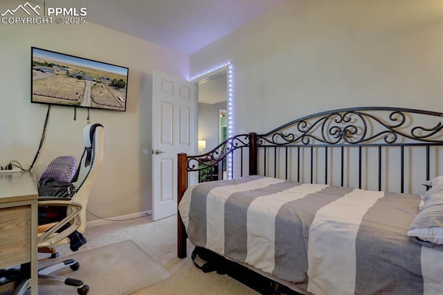 bedroom featuring carpet floors and baseboards