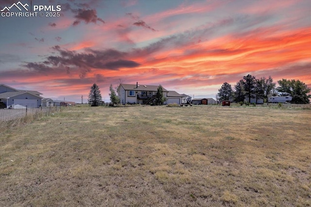 view of yard at dusk