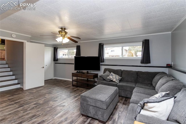 living room with ceiling fan, a healthy amount of sunlight, dark hardwood / wood-style floors, and ornamental molding