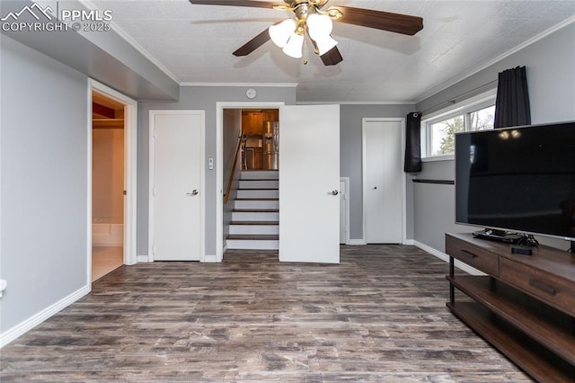 bedroom with ensuite bath, ceiling fan, wood-type flooring, and ornamental molding