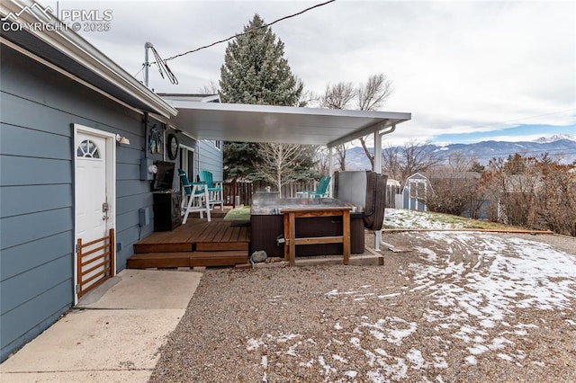 exterior space with a deck with mountain view