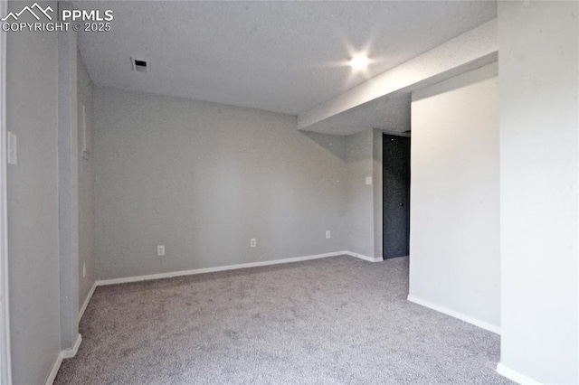 unfurnished room featuring light carpet