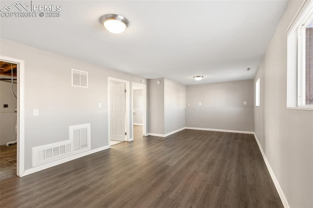 unfurnished room featuring dark hardwood / wood-style floors