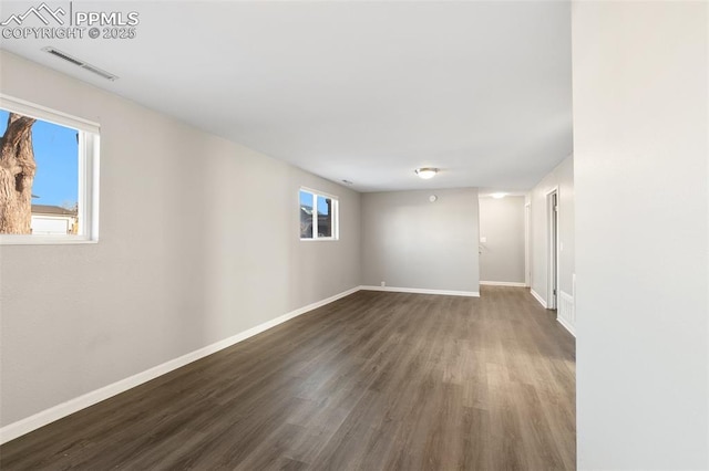 empty room featuring dark wood-type flooring