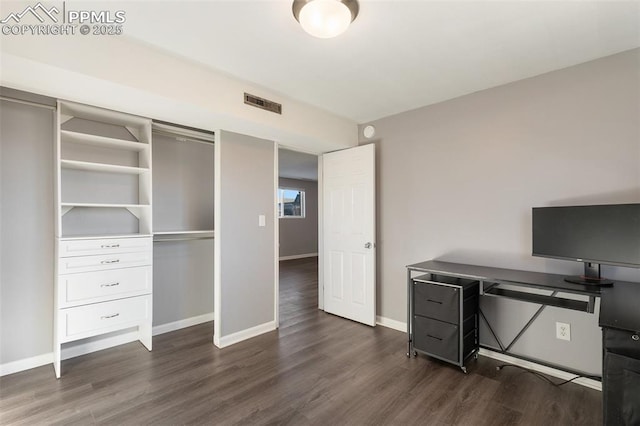 office space with dark hardwood / wood-style floors