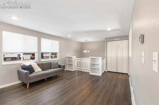 sitting room with dark hardwood / wood-style floors