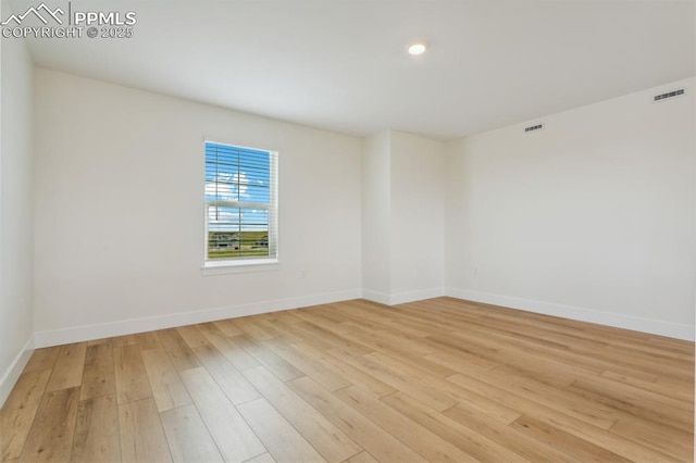 empty room with light wood-type flooring