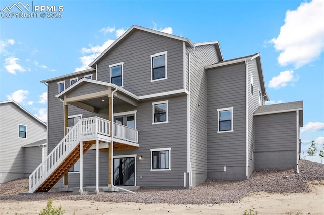 back of house with a wooden deck