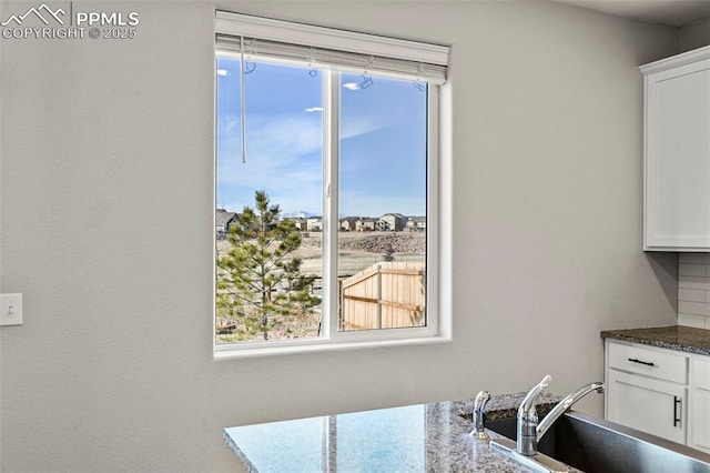 dining room with sink and plenty of natural light