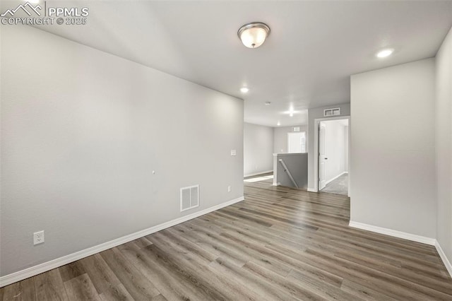 spare room featuring hardwood / wood-style flooring