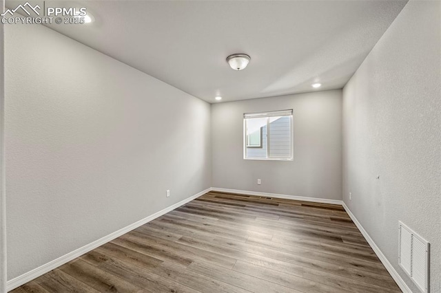 empty room featuring hardwood / wood-style floors