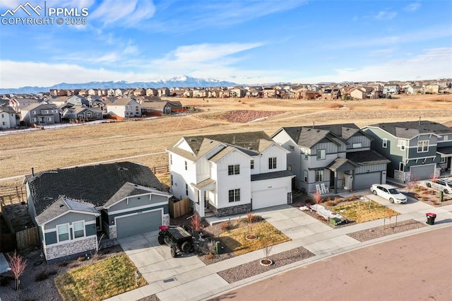 birds eye view of property with a mountain view