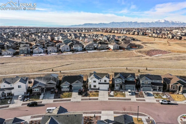 drone / aerial view featuring a mountain view