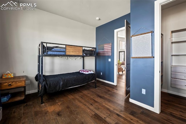 bedroom featuring dark hardwood / wood-style flooring