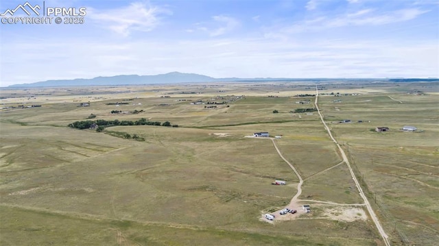 aerial view with a mountain view and a rural view