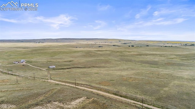 birds eye view of property with a rural view