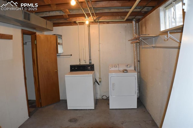 laundry area with washing machine and dryer