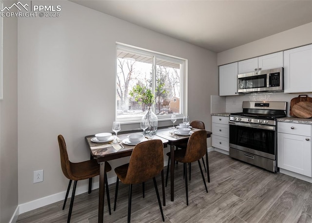 dining room with light hardwood / wood-style floors