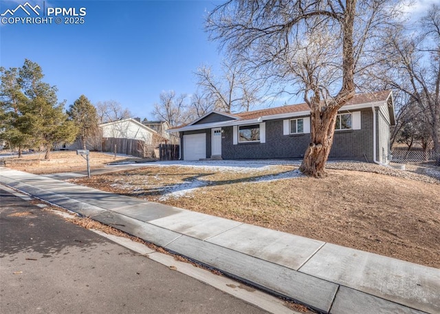 single story home with a garage