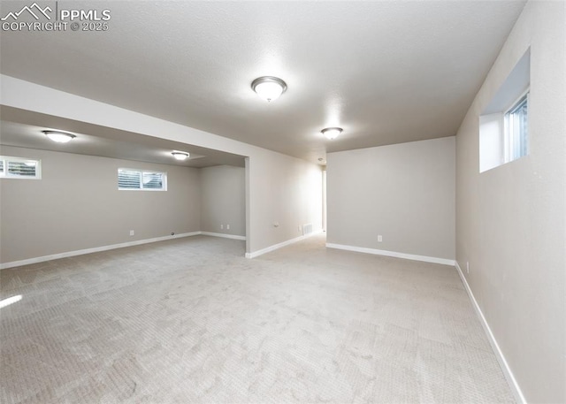 basement featuring carpet flooring