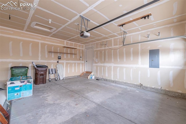 garage featuring electric panel and a garage door opener