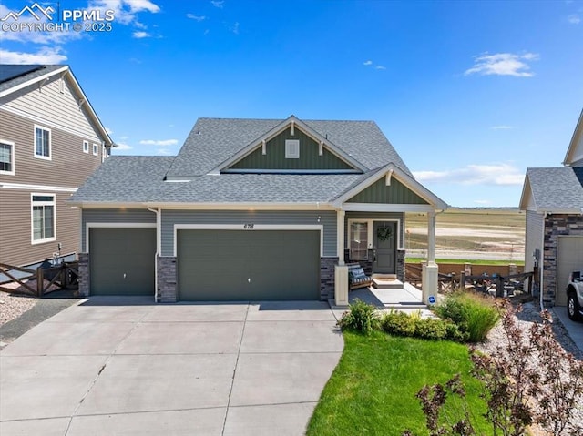 view of front of home with a garage and a front lawn