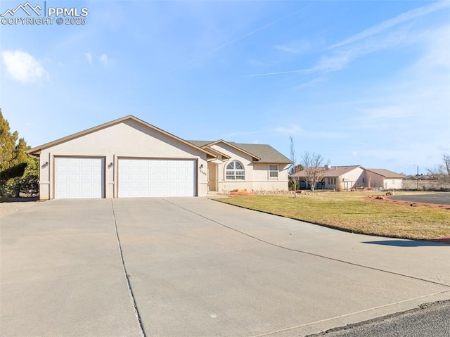 ranch-style house featuring a garage and a front lawn