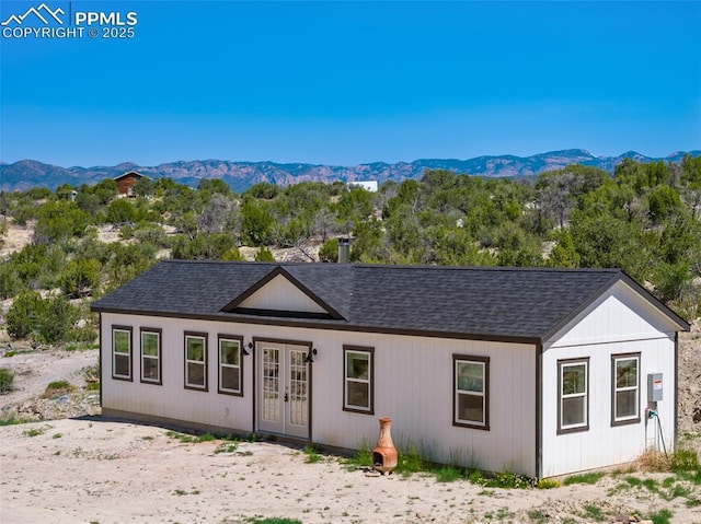 exterior space featuring a mountain view and french doors