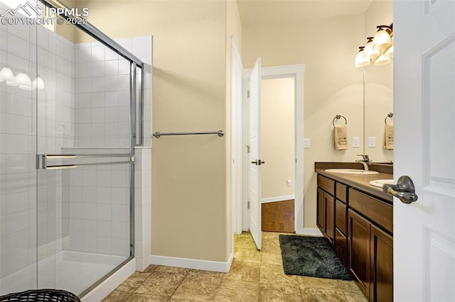 bathroom with vanity and walk in shower