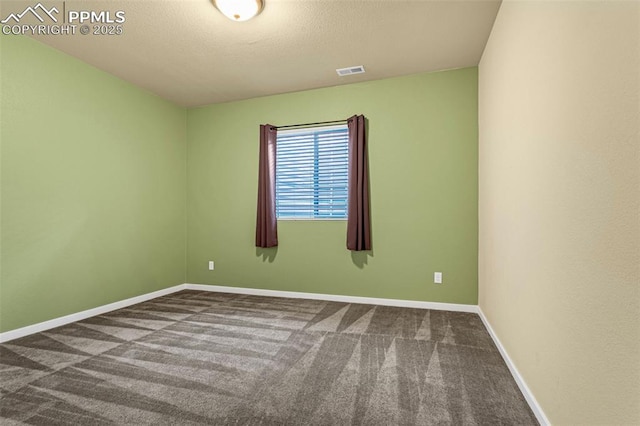 empty room featuring carpet floors