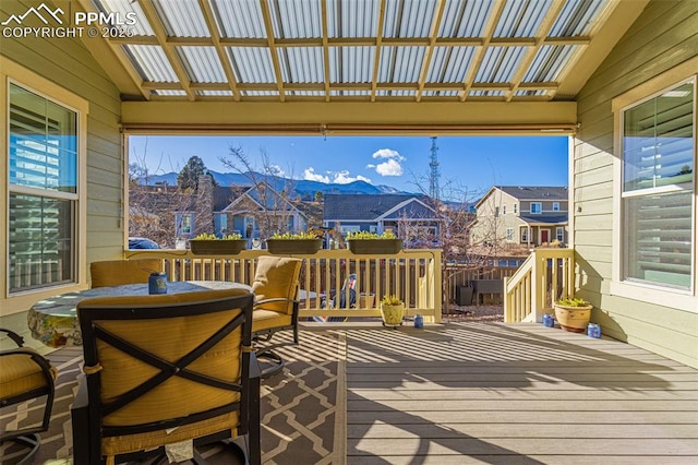 deck featuring a mountain view and a pergola